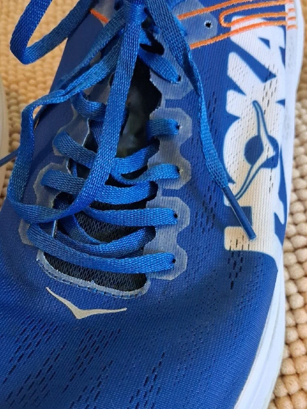 Hoka Blue and White Men's Running Shoes with Orange Accents